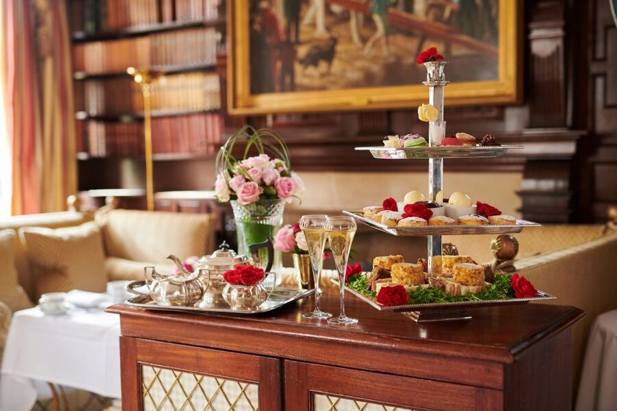 London: Afternoon Tea at The Milestone with Champagne Option - Scones, clotted cream, and preserves, plus the sandwich line-up