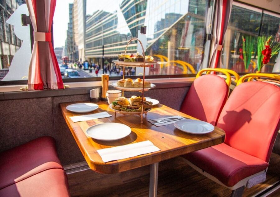 London: Afternoon Tea Bus with a Glass of Prosecco - The Food Setup: Sandwiches, Scones, Cakes, and Sharing Tables