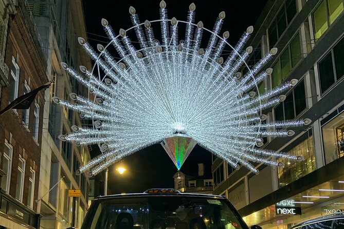 London Bespoke Black Cab Christmas Lights & Sights Private Tour - Harrods front lights and Leicester Square movie-premiere energy