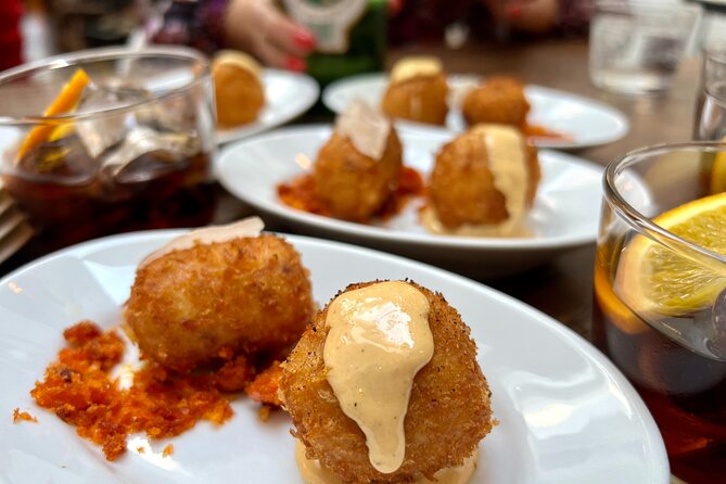 London Soho Food Tour with 7+ Tastings of Delicious Hidden Gems - Stop 4 at Peter Street and Berwick Street: adult entertainment district context