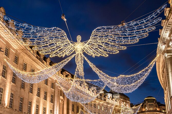 Magical London Christmas Lights Walking Tour with a Londoner - Piccadilly Circus after dark, digital lights with serious crowd power