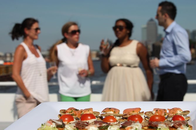 River Thames Evening Cruise with Sparkling wine and Canapés - Tower Millennium Pier check-in: show up early, then relax